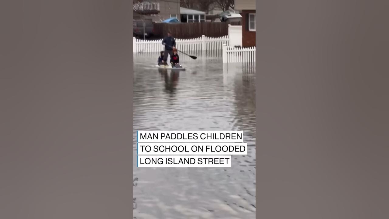 Man paddles children to school in flooded Long Island streets