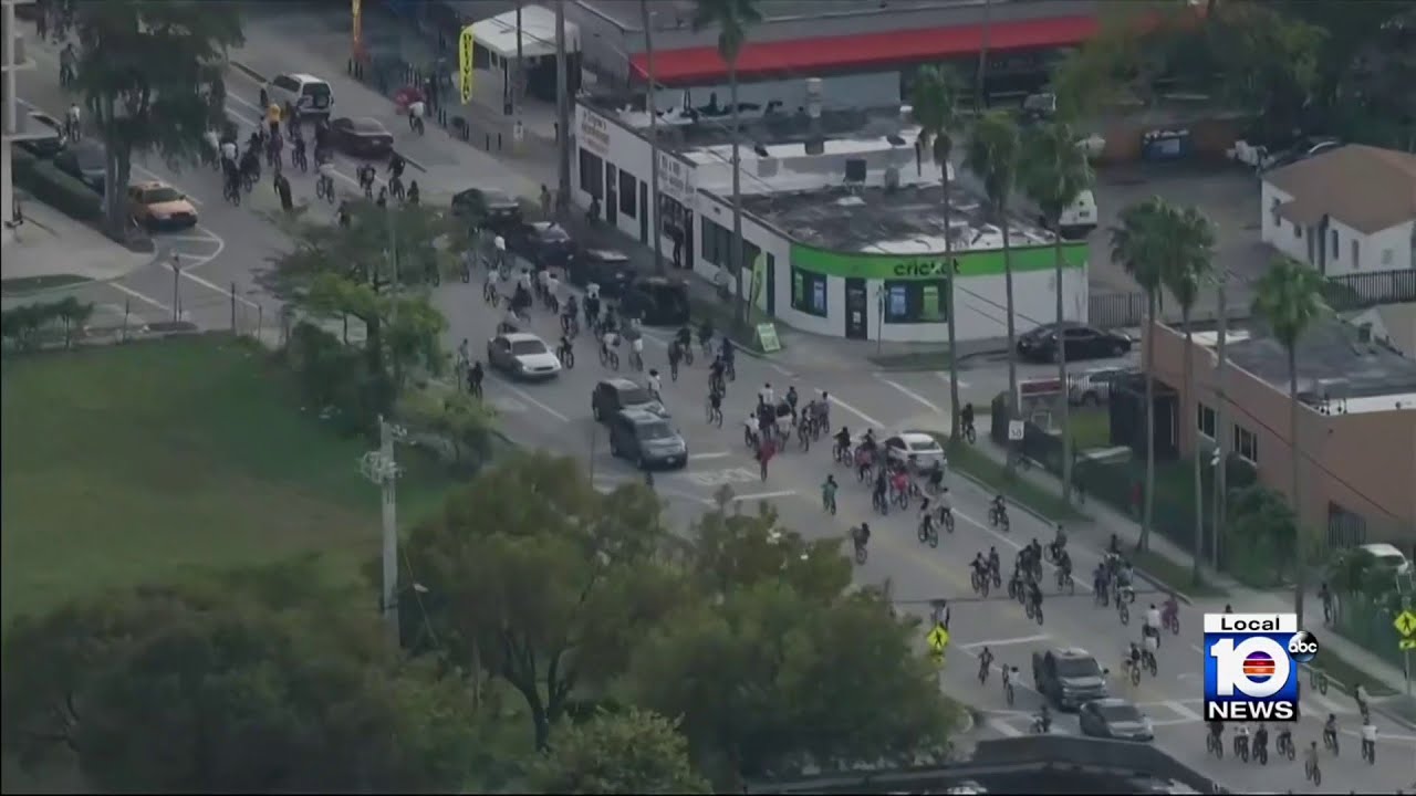 Riders taking part in Wheels Up, Guns Down travel through Miami-Dade streets