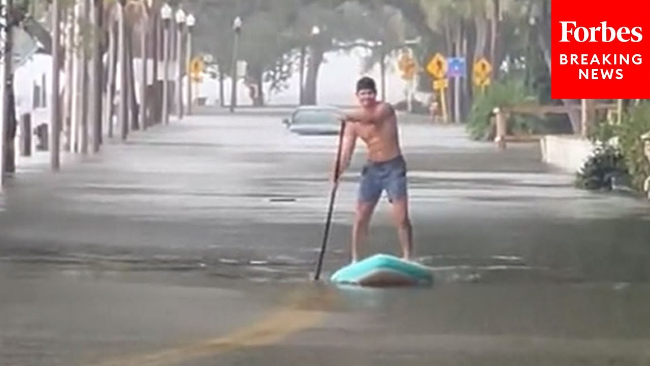 Florida Man Paddle Boards In Flooded St. Petersburg Neighborhood As Idalia Passes Through The State