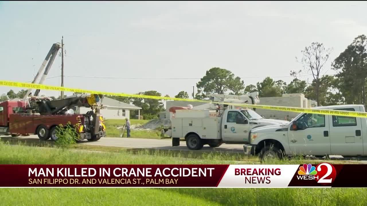 Man dead after crane collides with power lines, setting cab on fire in Palm Bay