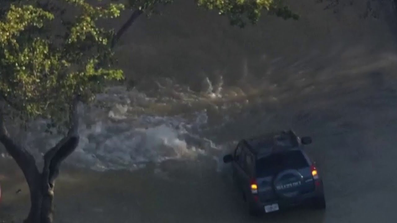 Large water main break strands SUV in Miami Lakes