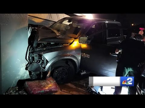 Pickup truck smashes into Lehigh Acres home with two vehicles parked in driveway