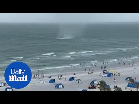 Moment brutal waterspout storm wipes out Florida's infamous Clearwater Beach